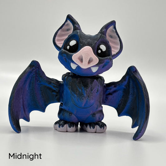 Shown with a micro mini version, these medium sized vampire bats are printed in dark blue-black filament.