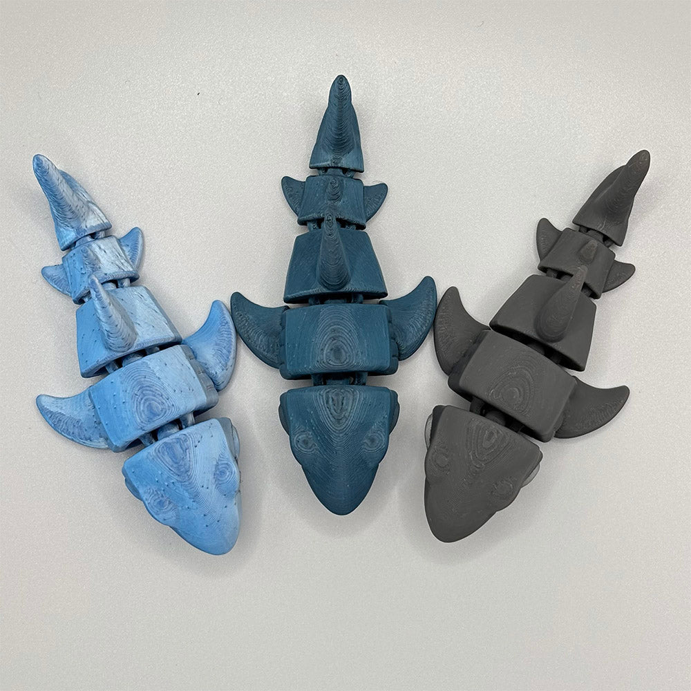 Three great white shark figures have been 3D printed using PLA filament.  With blue and grey colour options, the sharks are available to buy in the UK, from 3D Busy Hands by Lizzyanthus.