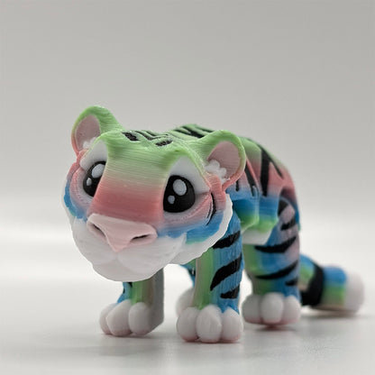 An adorable 3D Printed-in-Place rainbow tiger designed by Matire Makes as a flexible fidget toy