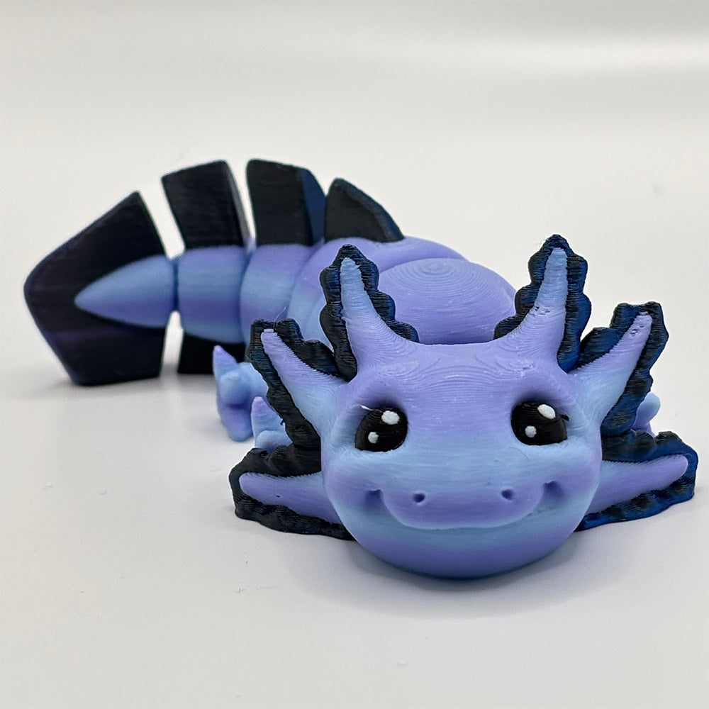 A 3D printed, happy and smiling axolotl fidget toy with segmented flexible body