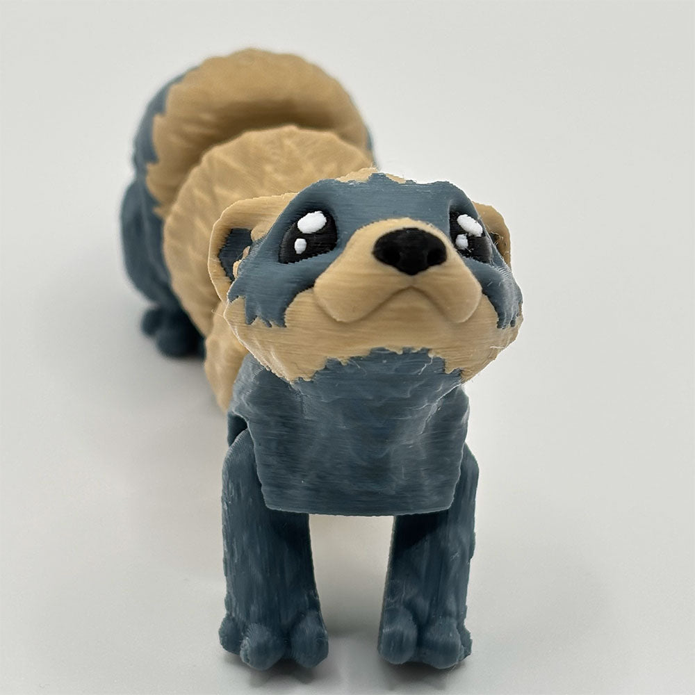 3D printed palm-sized ferret fidget toy with articulated joints and flexible body