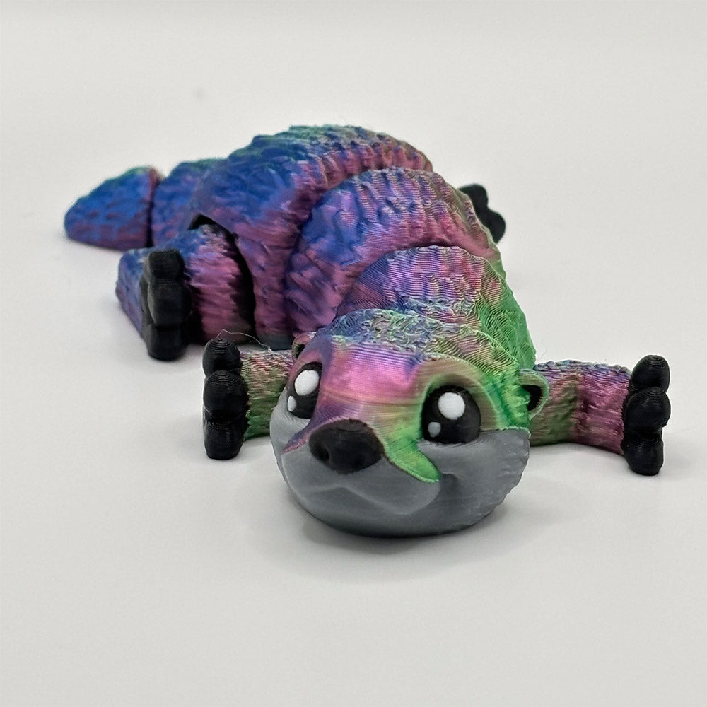 3D printed baby otter with multicoloured fur and a flexible segmented body for fidgeting hands